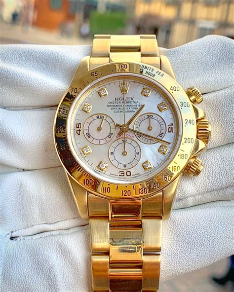 rolex daytona gold watch